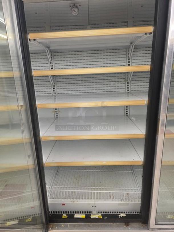 Hussmann Gel-5 frozen food door with shelving, no compressor. Sold by door, good condition. Buyer removes.