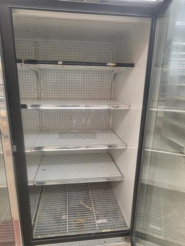 Hussmann Gel-5 frozen food door with shelving, no compressor; metal shelves; buyer to remove; sold by door.