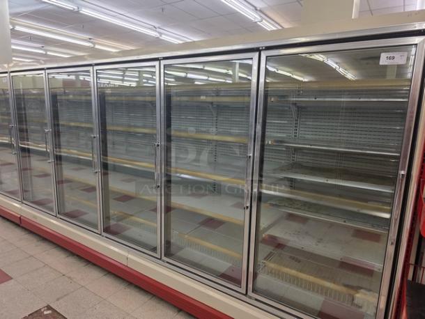 Hussmann Gel-5 frozen food doors with shelving, no compressor, glass front, sold by door. Buyer removes, 25 doors available.