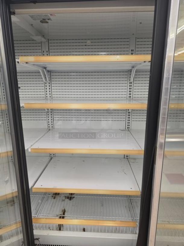 Hussmann Gel-5 frozen food display door with shelving, no compressor, sturdy build, sold individually, minor wear visible.
