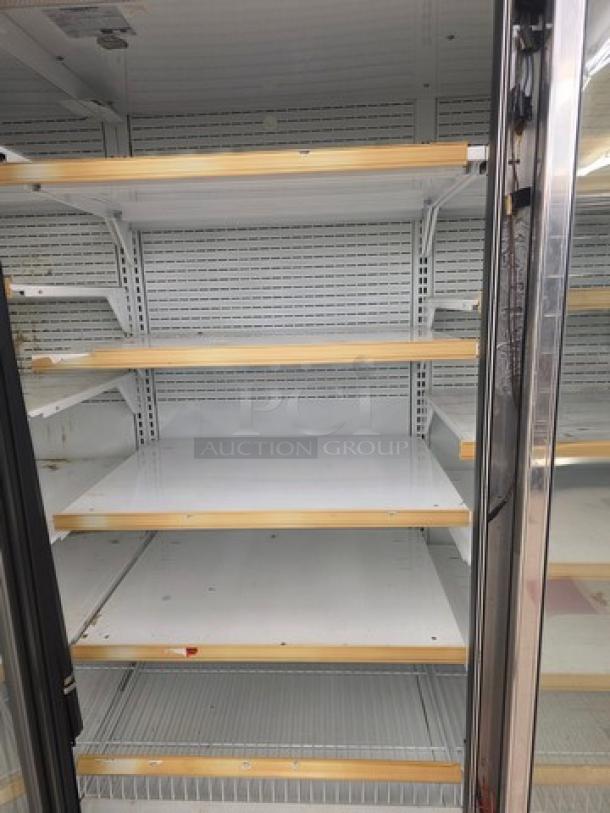 Hussmann Gel-5 frozen food door with shelving, no compressor, metal frame, glass door, and adjustable shelves.