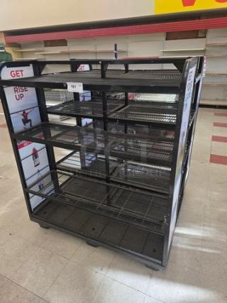 Black metal retail display rack with multiple wire shelves, "GET" and "RISE UP" branding on side panels, in good condition.