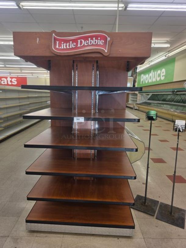 Little Debbie retail display shelf with five wooden tiers, branded top sign, sturdy construction, suitable for merchandising.