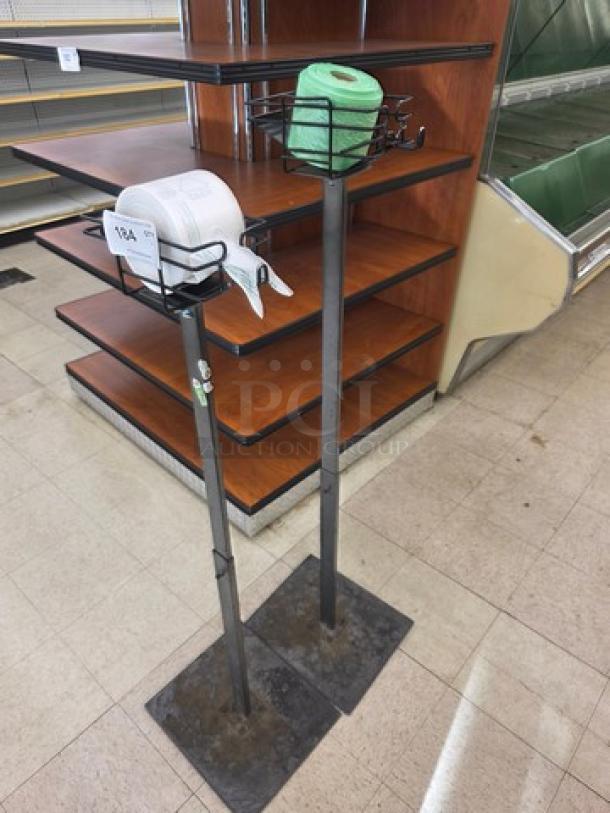 Lot of 2 bag holder stands, metal construction, adjustable height, sturdy base, with roll holders, used condition.