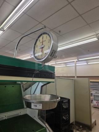 Toledo Model 2110 commercial hanging scale with large round dial, metal frame, and attached weighing pan.