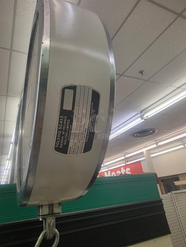 Toledo Model 2110 Commercial Hanging Scale, metal casing, side view showing model label, good condition.