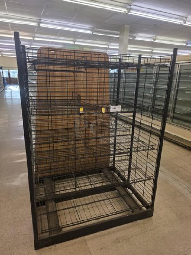 Black wire shelving unit with multiple tiers, used condition. Price tag visible. Ideal for storage or retail display.