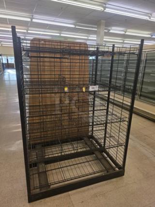 Black wire shelving unit with multiple tiers, used condition. Price tag visible. Ideal for storage or retail display.