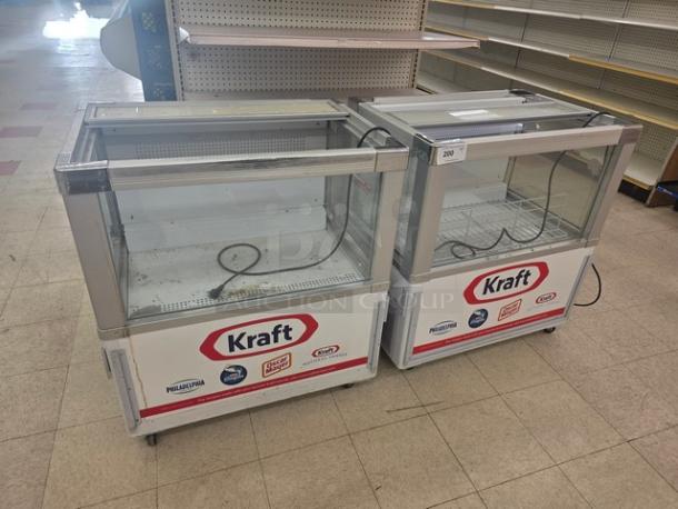 Lot of 2 Intertek SC-165W refrigerated grab-and-go merchandisers, used, with Kraft branding. Glass front, visible power cords.