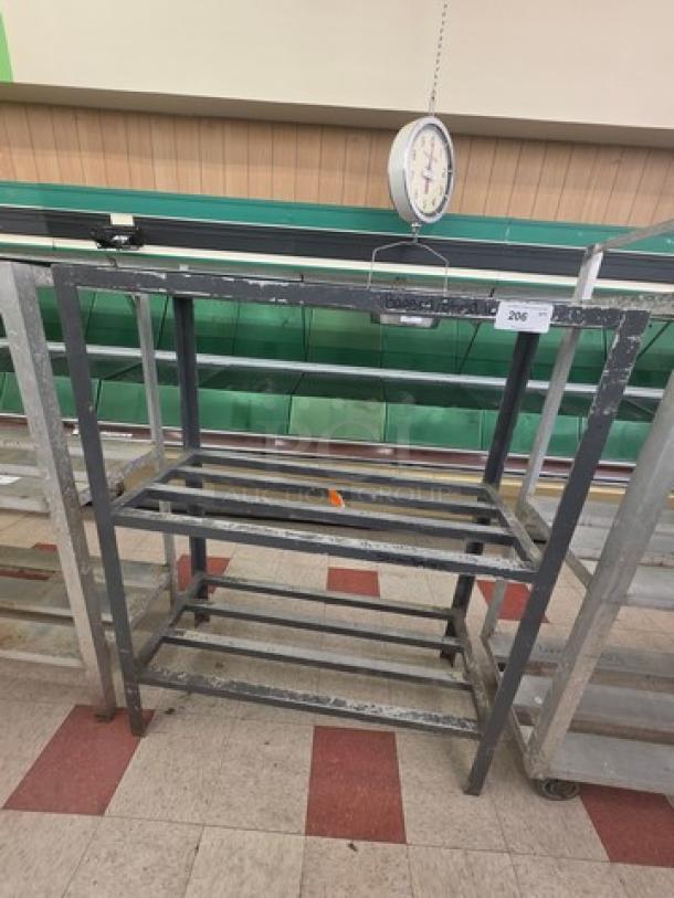 Aluminum shelf cart with two tiers, sturdy frame, slight wear. Marked with auction tag #206. Suitable for storage.