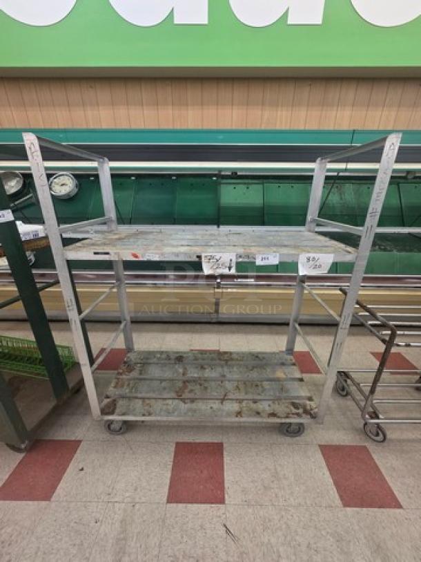 Aluminum mobile shelf cart with two rusted shelves, four wheels, and visible wear. Tags displaying $80 price.
