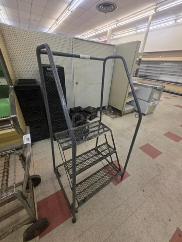 Cotterman rolling ladder, three steps, metal construction, sturdy rails, gray finish, excellent condition, ideal for warehouse use.