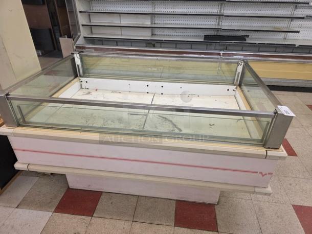 Hussmann ISMG-5R Single-Deck Refrigerator Island Merchandiser, glass panels, visible wear, spacious interior.