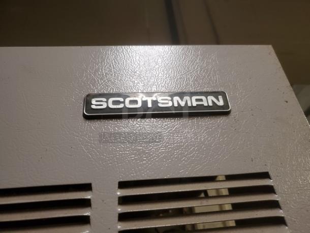 Scotsman Flake Ice Machine with Bin, model FME2400AE-3A. Features visible logo. Used condition.