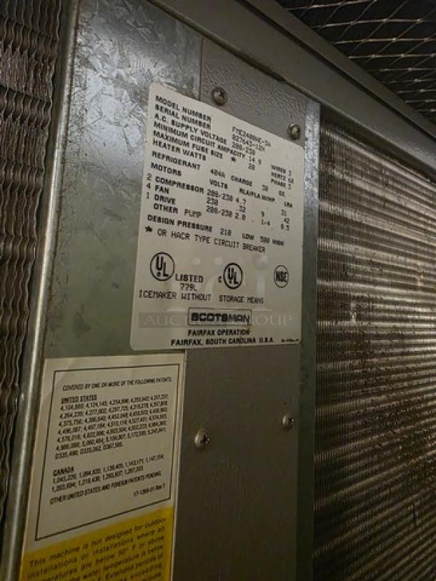 Scotsman Flake Ice Machine FME2400AE-3A with bin; UL listed; details on model, voltage, phase visible on label.