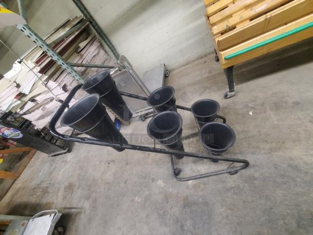 Mobile flower display stand with six black cones on a metal frame. In good condition, ideal for showcasing floral arrangements.