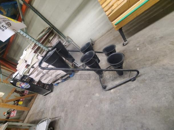 Mobile flower display stand with six black removable pots, metal frame, and wheels. Good condition, ideal for retail use.