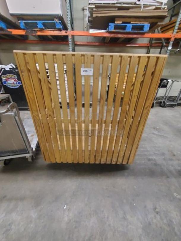 Wooden utility cart with slatted design, sturdy construction. Visible tag with number 259. Ideal for storage or transport.