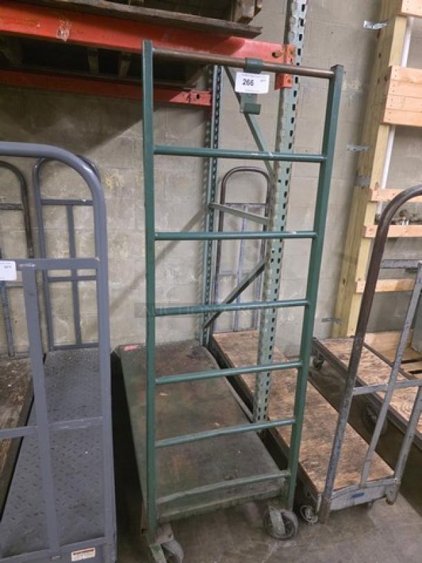 Green metal utility cart with four wheels and ladder-style sides. Item number 266. Used condition, suitable for industrial use.