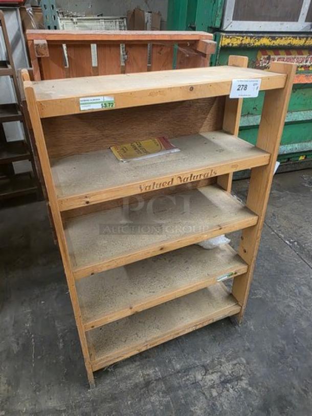 Wooden display bin with four shelves, labeled "Valued Naturals." Used condition, visible wear. Auction tag 278 attached.