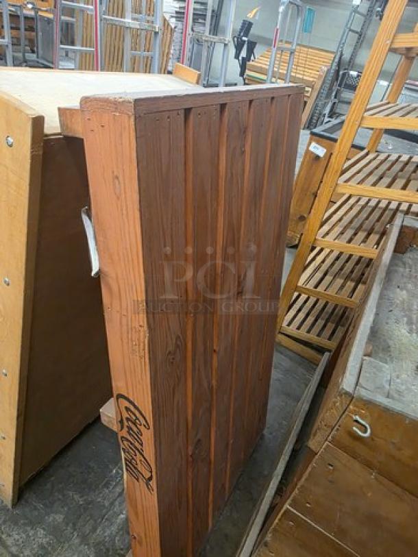 Wooden shelves, bench, and display bin; sturdy construction, used condition, visible Coca-Cola logo on one piece.