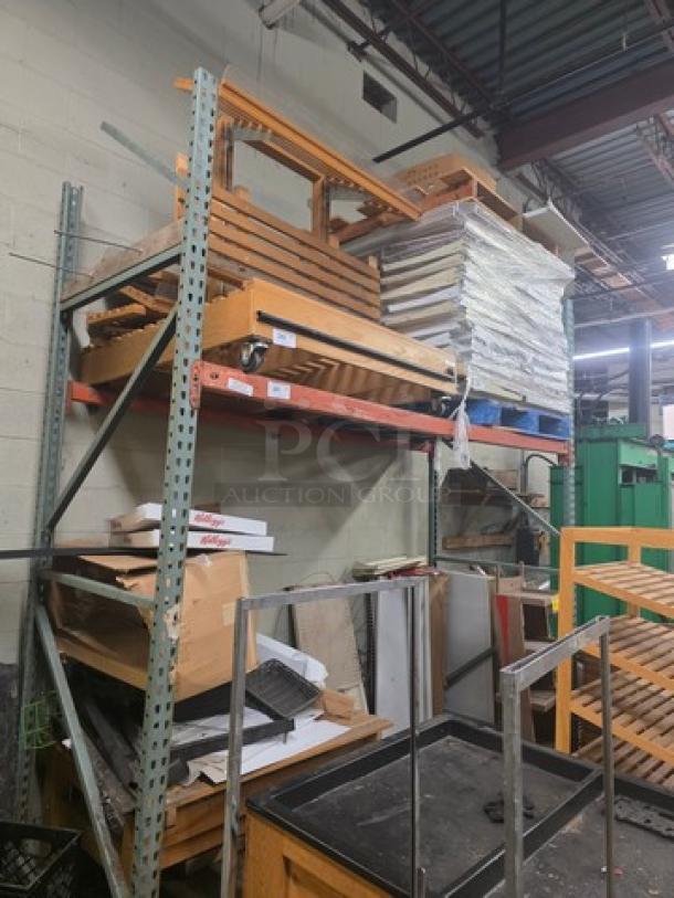 Industrial pallet racks with metal frame, in used condition. Contents on rack not included. Ideal for warehouse storage.