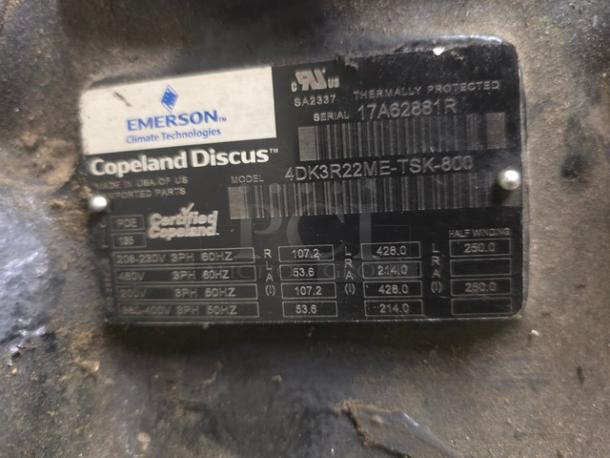 Copeland 4DK3R22ME-TSK-800 semi-hermetic compressor, label shows specifications: 208-230/460/3/60, thermally protected.