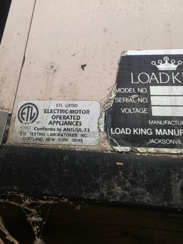 Supermarket checkout counter with ETL label indicating compliance with ANSI/UL-73. Unknown condition. Model, serial, and voltage details are missing.