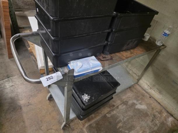 Metal utility cart with a wooden top, two shelves, and metal handles. Auction tag reads "292". Contents not included.