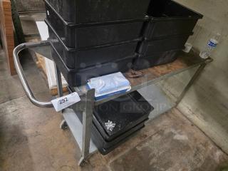 Metal utility cart with a wooden top, two shelves, and metal handles. Auction tag reads "292". Contents not included.