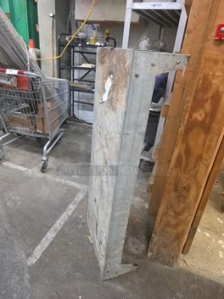 Metal dunnage rack, used condition with visible rust and wear. Sturdy construction, ideal for storage solutions.