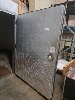 Walk-in door with metal finish, diamond plate lower panel, and mounted hardware. Includes handle and hinges. Good condition.