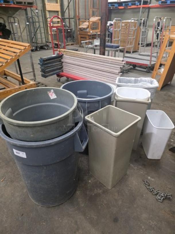 Lot of assorted trash cans in various shapes and sizes, good condition, gray and white colors. Some minor wear visible.