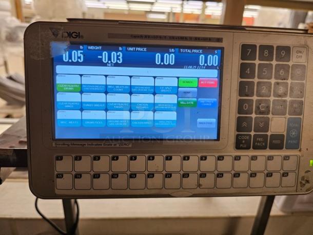 Digi SM5500B Manual Meat Wrapping Station with digital display, keypad, and visible control buttons, in good condition.
