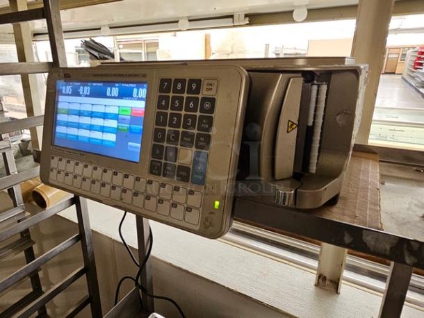 Digi SM5500B Manual Meat Wrapping Station with digital display and keypad; robust condition.