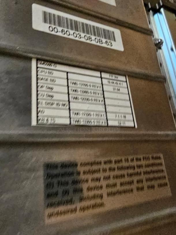 Digi SM5500B Manual Meat Wrapping Station with visible model and compliance labels. Durable and well-maintained.