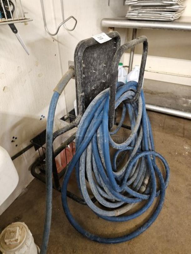 Ecolab low-pressure foam cleaning system on portable cart, blue hoses coiled, used condition, suitable for industrial cleaning.