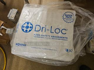 Lot of Novipax Dri-Loc food safety absorbents in original packaging. Designed for meat, poultry, seafood, and produce. Made in USA.
