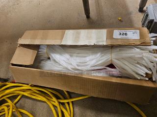 Open cardboard box containing a lot of white handy nets, used for various purposes, with labeling indicating auction lot 326.