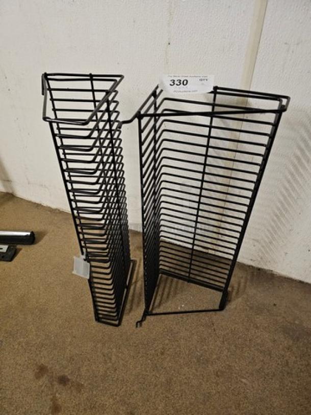 Lot of 2 wall-mountable wire racks, black metal, vertical slots for organizing, good condition, auction tag #330.