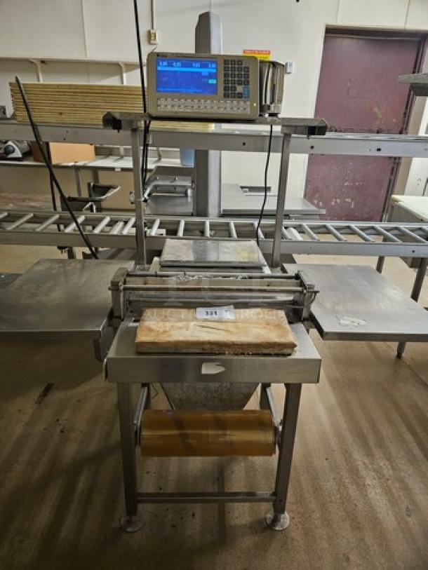 Digi SM5500a Manual Meat Wrapping Station, stainless steel frame, integrated scale, digital display, used condition.