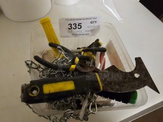 Lot of miscellaneous tools, including pliers, scraper, and metal chain, in used condition. Lot number 335 visible.