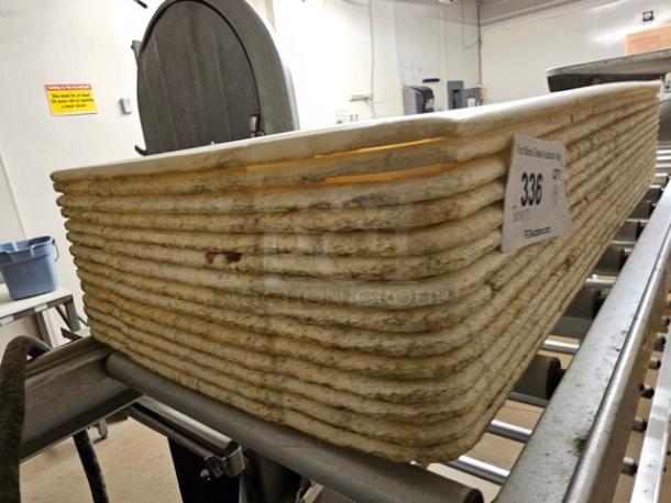 Lot of 14 stacked plastic trays, used condition with visible wear. Note on side: "336," indicating auction identification.