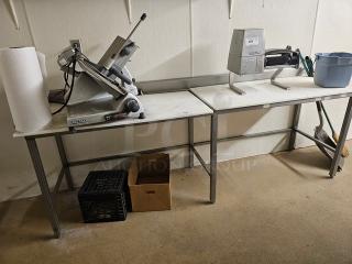 Cutting board butcher block table, sturdy metal legs, rectangular shape, clean surface, contents not included.