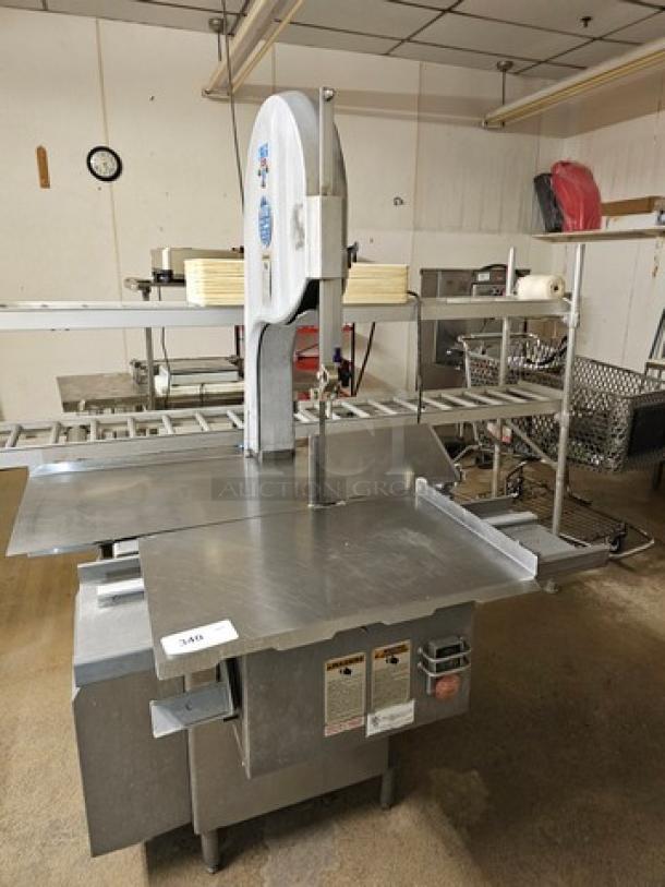 Biro Meat Saw model 3334 in stainless steel. Features adjustable cutting guides. Condition appears used.