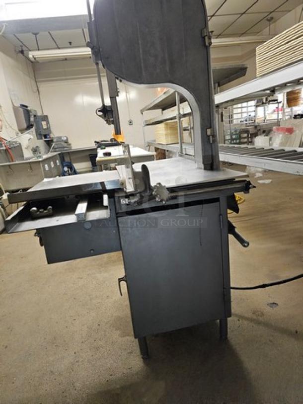 Biro Meat Saw model 3334, industrial-grade, metal construction, used condition, features adjustable blade and safety guard.