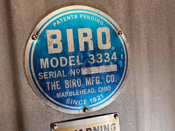 Biro Meat Saw model 3334 label, blue circular plaque; shows brand, model, and location details; indicates "Patents Pending."