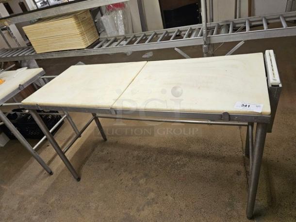Stainless steel cutting board butcher block table with two white removable surfaces, used condition, tag labeled "341".