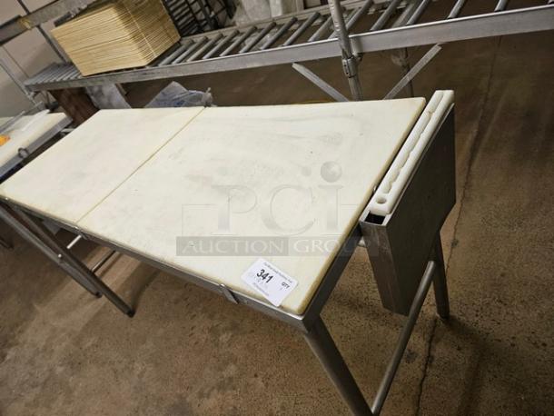 Cutting board butcher block table, stainless steel frame, integrated knife holder, moderate wear, auction tag labeled "341".