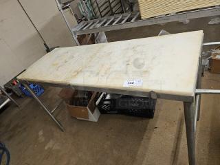 Cutting board butcher block table with steel legs, showing signs of wear. Marking indicates item number 342.